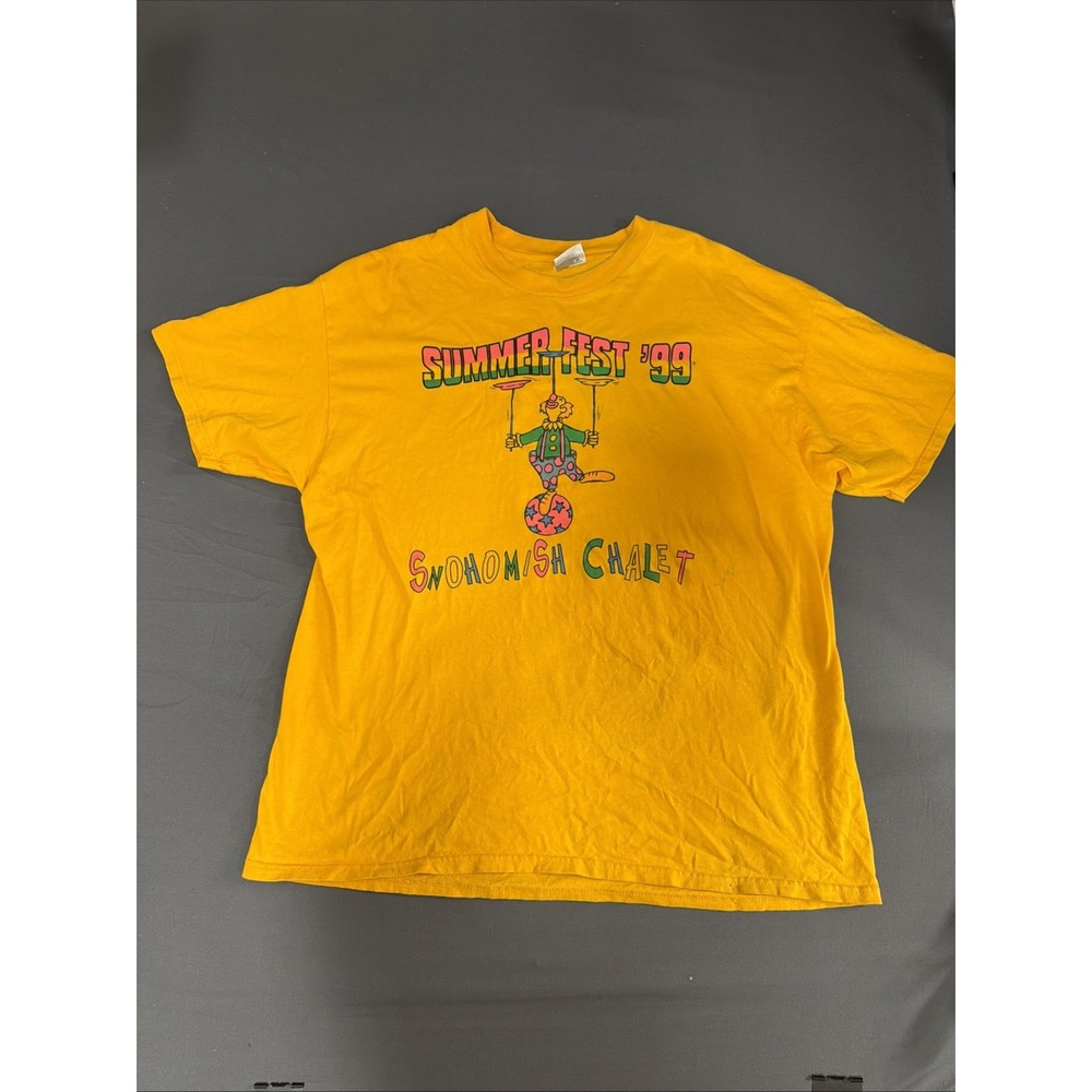 vintage yellow graphic t-shirt featuring a playful clown balancing XXL